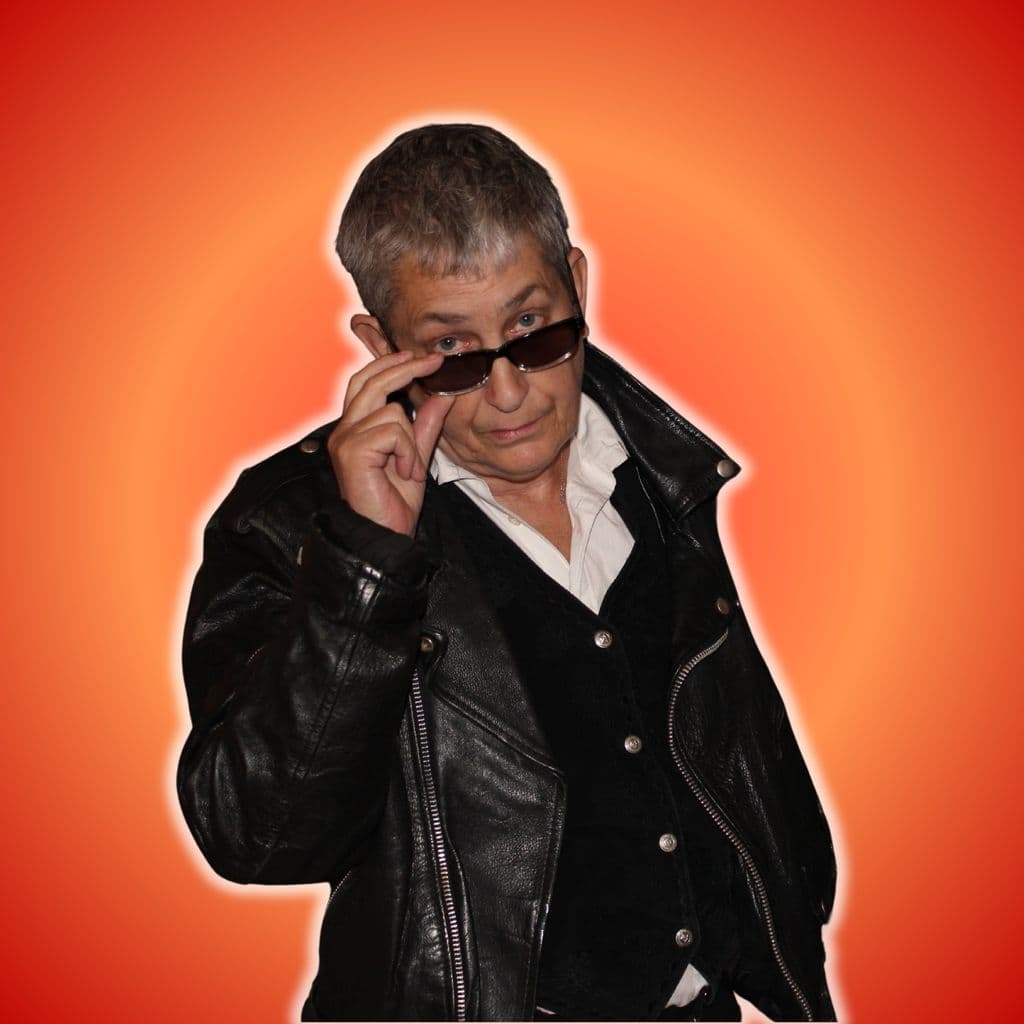 Claire Dowie in leather jacket and shades