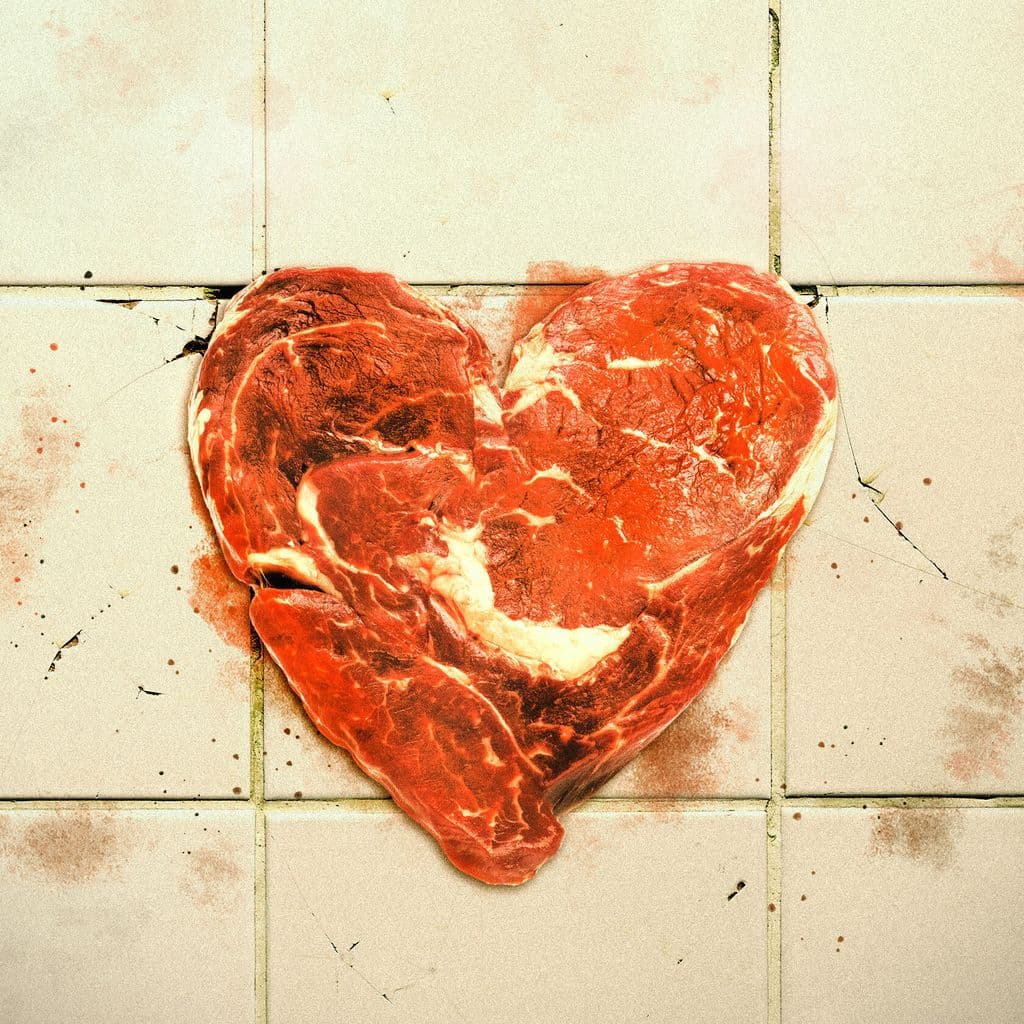 A heart shape made out of off cuts of raw meet